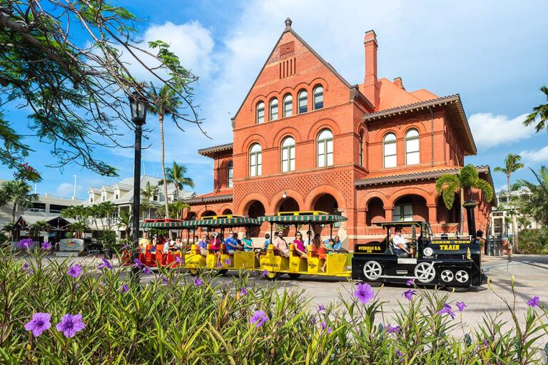 Conch Tour Trains driving past Custom House