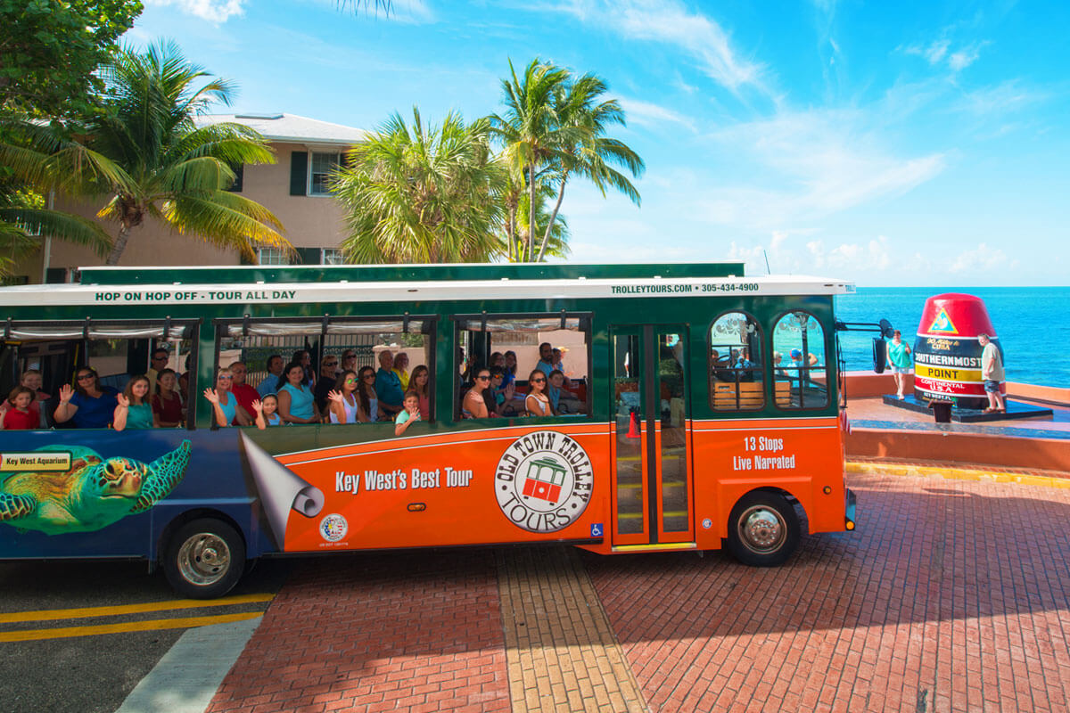 Key West Old Town Trolley driving past Southernmost Point